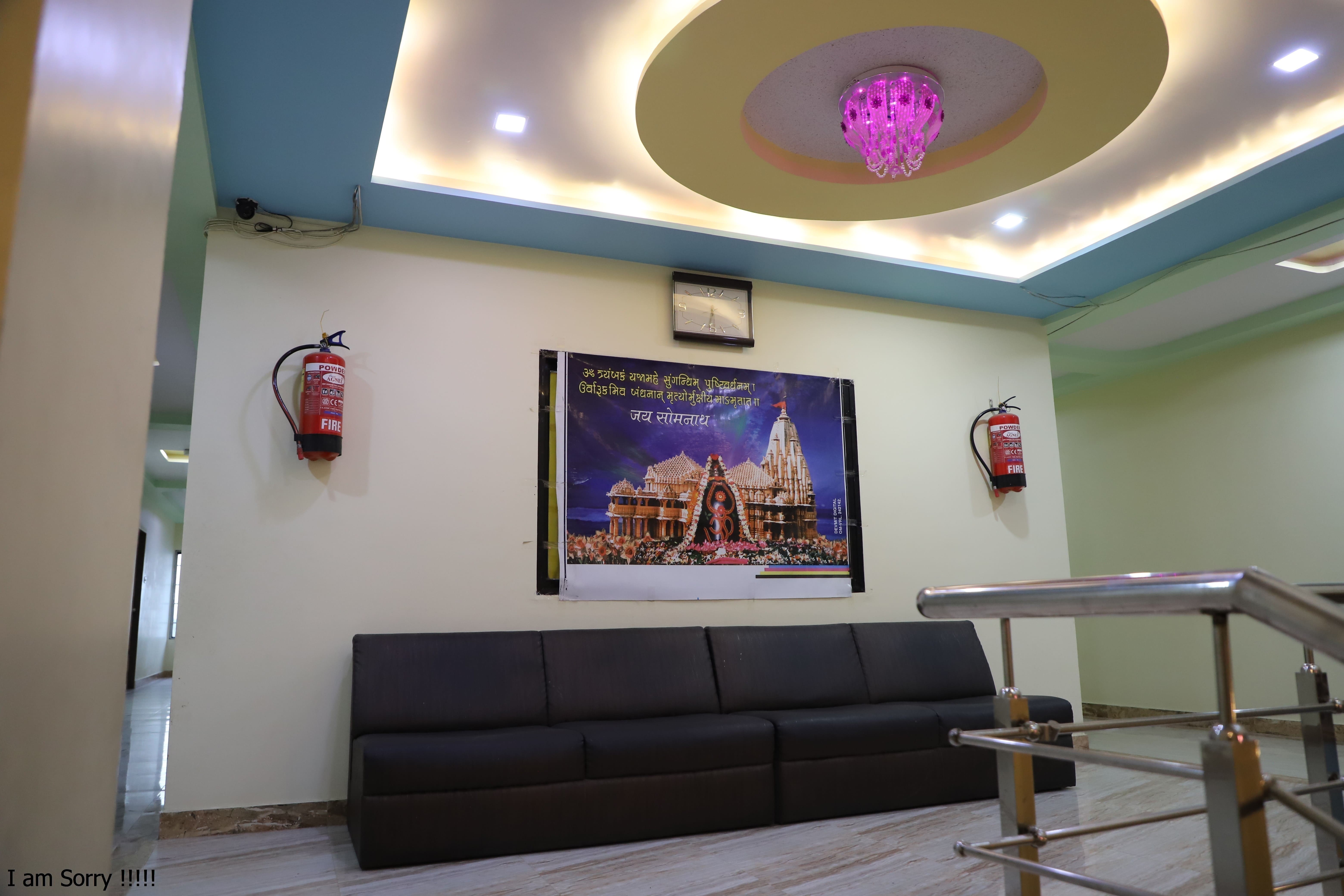 Hotel Somnath Sagar's modern reception and comfortable guest sitting area, welcoming visitors.