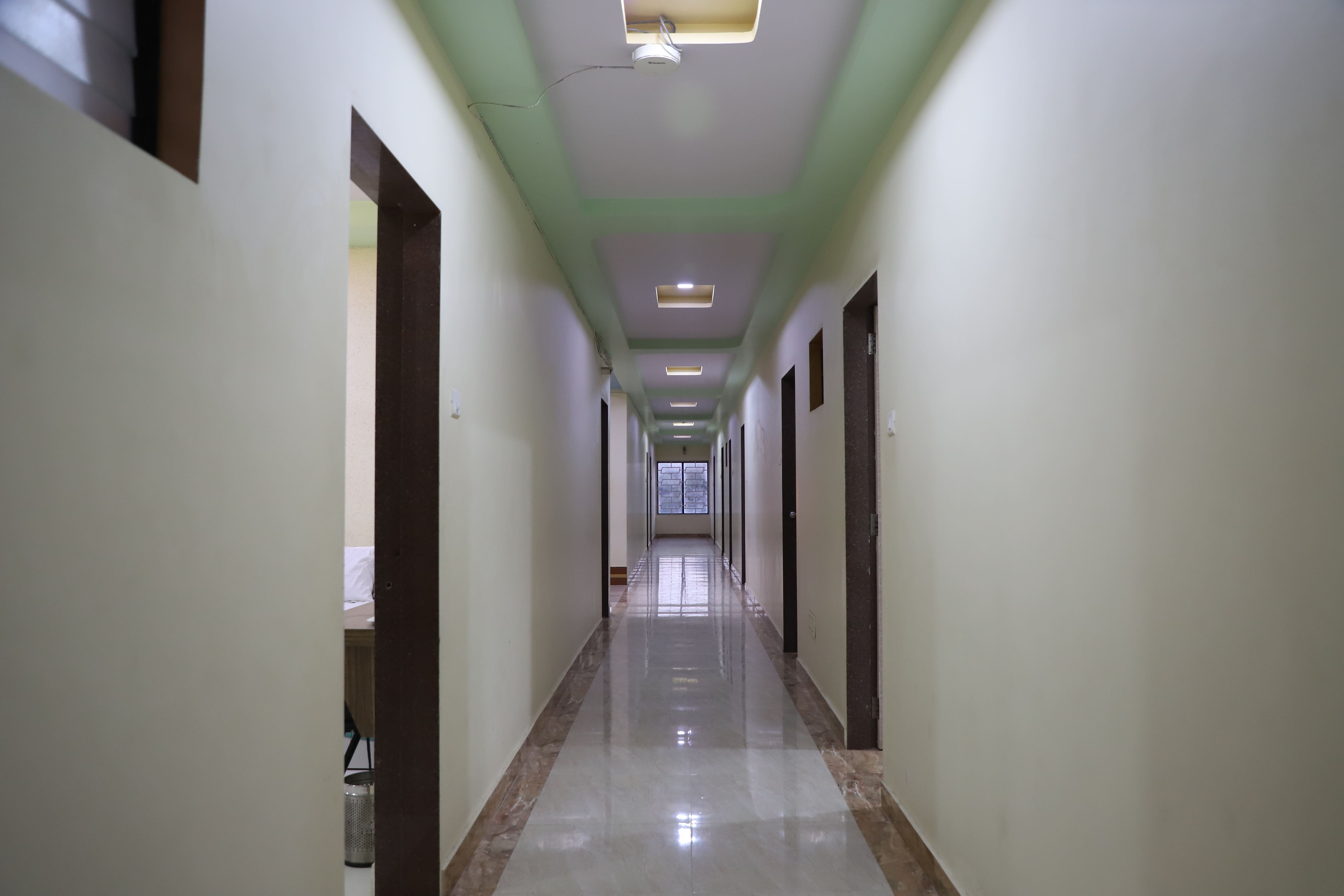 Hotel Somnath Sagar's modern reception and comfortable guest sitting area, welcoming visitors.