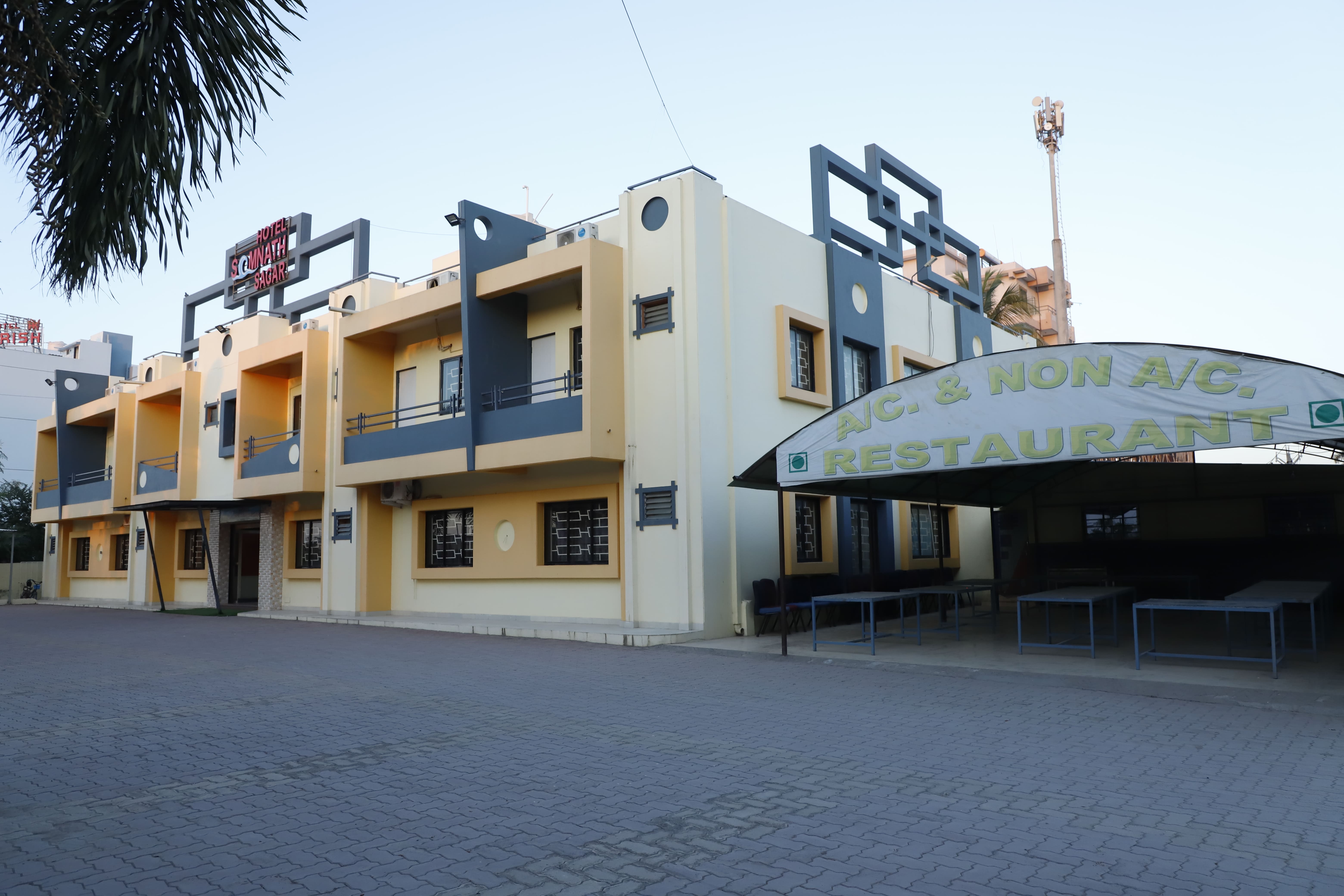 Hotel Somnath Sagar's modern reception and comfortable guest sitting area, welcoming visitors.