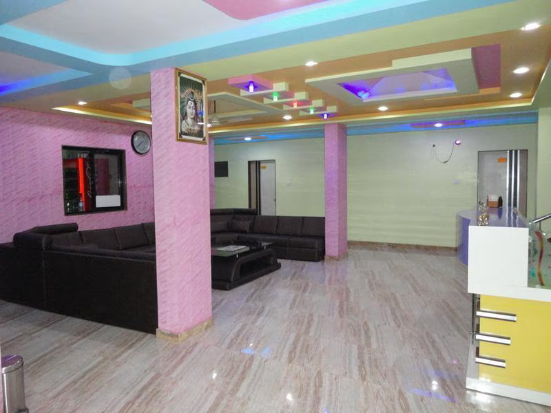 Hotel Somnath Sagar's modern reception and comfortable guest sitting area, welcoming visitors.