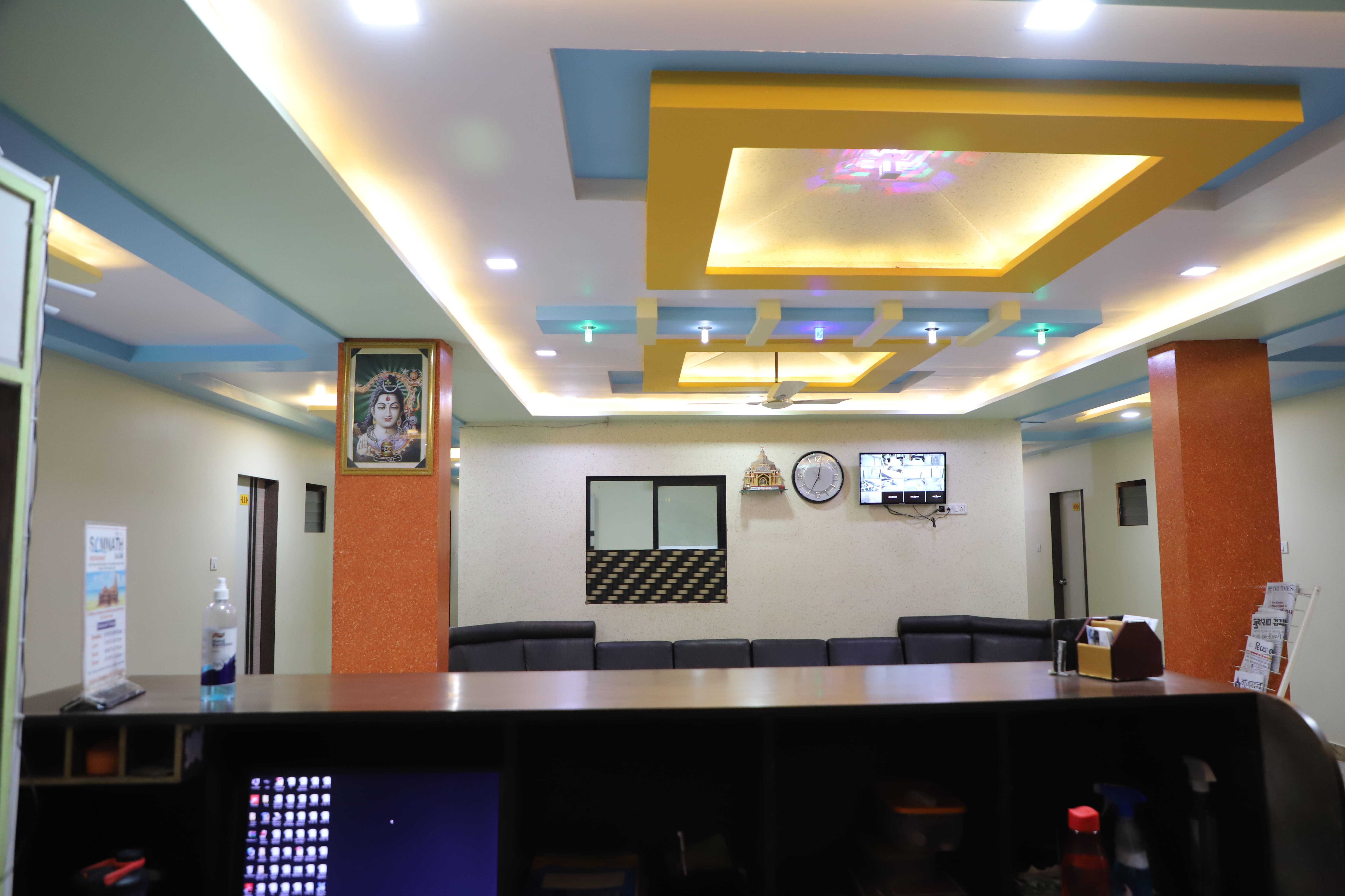 Hotel Somnath Sagar's modern reception and comfortable guest sitting area, welcoming visitors.