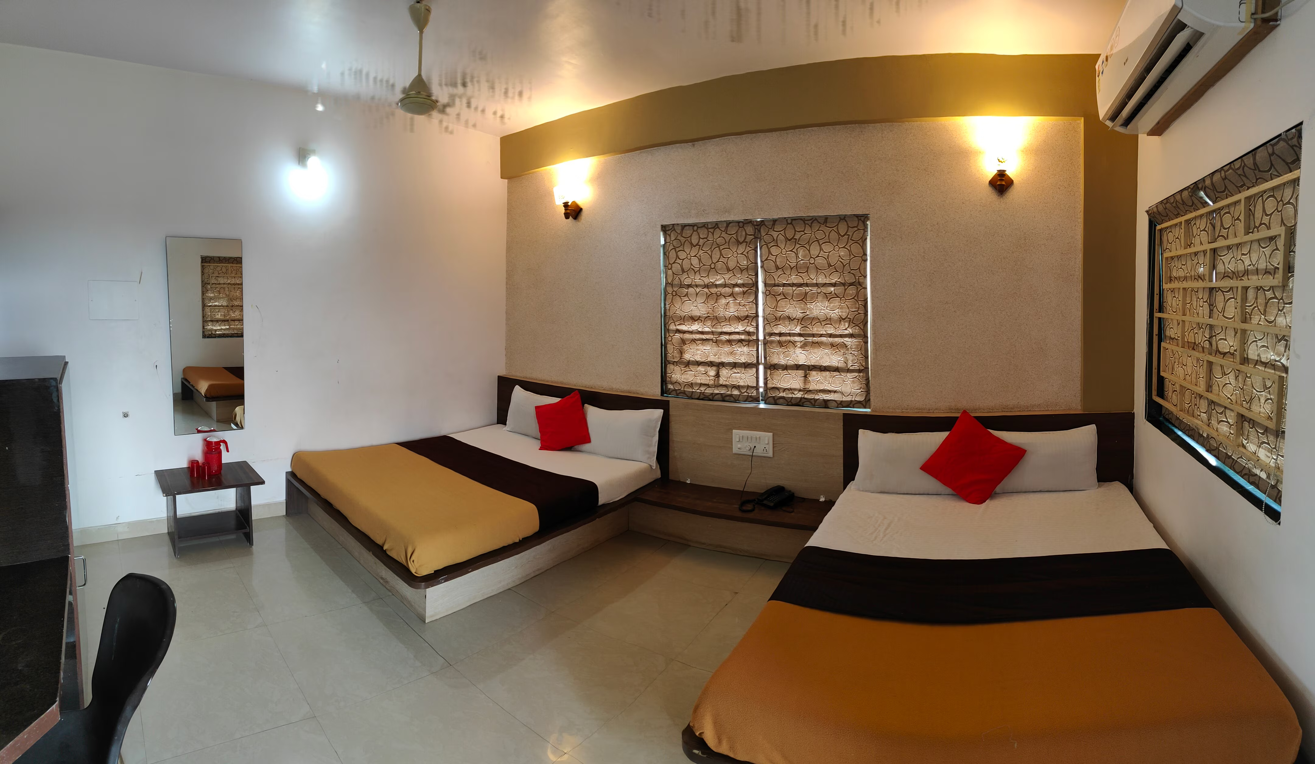 Large Four Bed Room at Hotel Somnath Atithigruh, suitable for groups and families on pilgrimage.